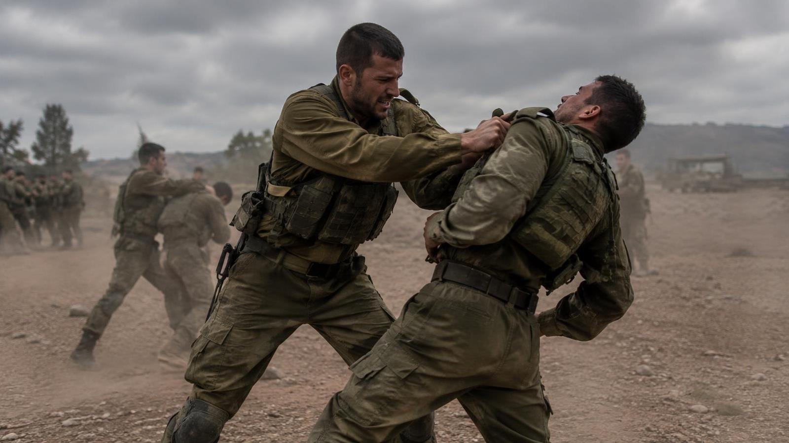 Soldiers practicing hand-to-hand combat on an outdoor training ground Soldiers practicing hand-to-hand combat on an outdoor training ground