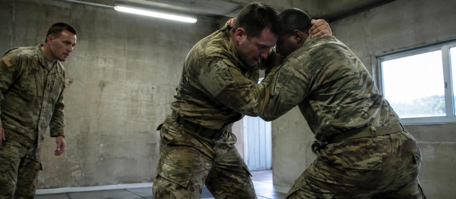 Soldiers drilling a standing clinch in a concrete training bay